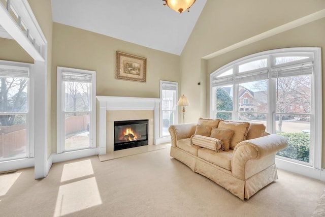 2740 Heritage Bend Ct SW, Grayson, GA 30017 - carpeted living room with high vaulted ceiling and a fireplace with flush hearth