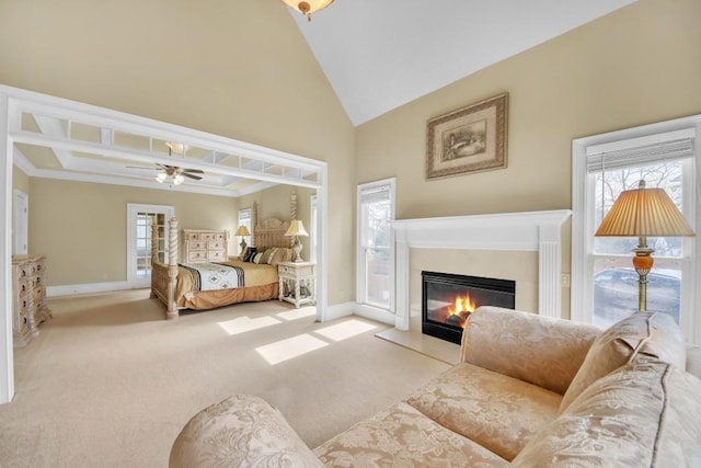 2740 Heritage Bend Ct SW, Grayson, GA 30017 - carpeted living room featuring baseboards, a fireplace with flush hearth, ceiling fan, and high vaulted ceiling