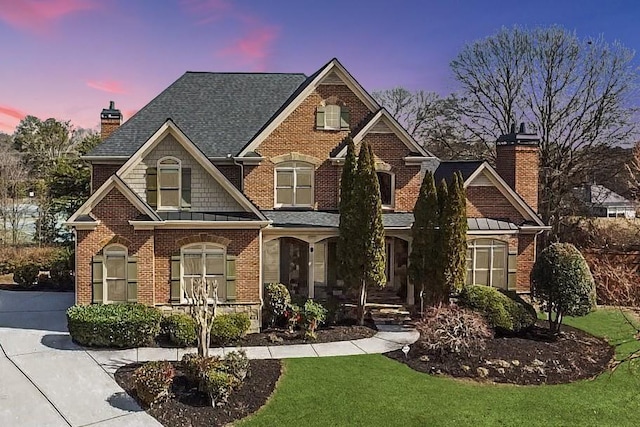 2740 Heritage Bend Ct SW, Grayson, GA 30017 - view of front facade featuring a chimney, brick siding, covered porch, a shingled roof, and a yard