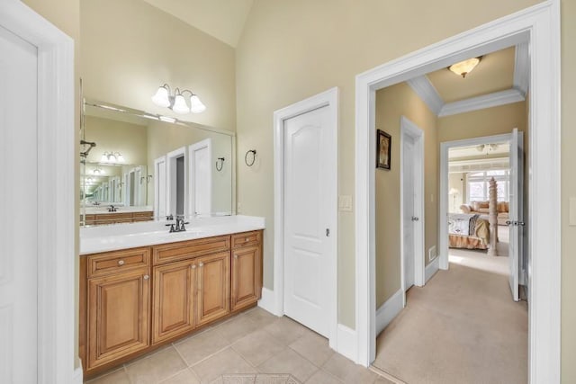 2740 Heritage Bend Ct SW, Grayson, GA 30017 - ensuite bathroom with crown molding, vanity, baseboards, and lofted ceiling