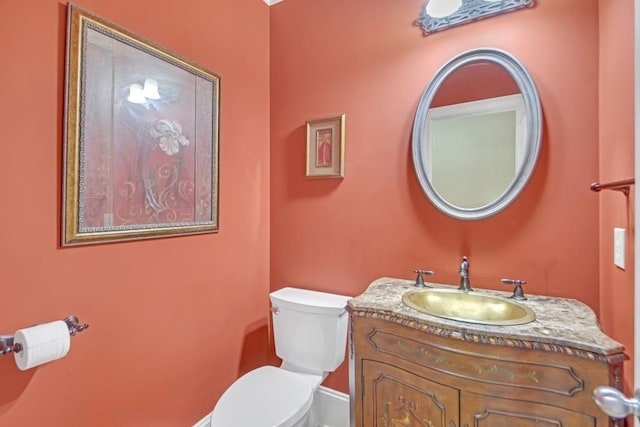 2740 Heritage Bend Ct SW, Grayson, GA 30017 - half bathroom featuring toilet, vanity, and baseboards