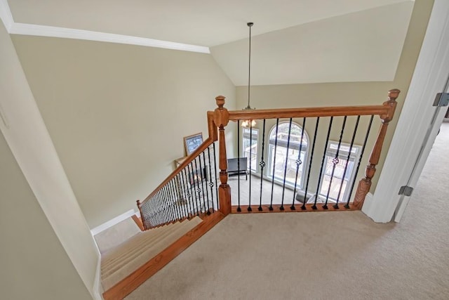 2740 Heritage Bend Ct SW, Grayson, GA 30017 - stairway featuring carpet floors, lofted ceiling, crown molding, and baseboards