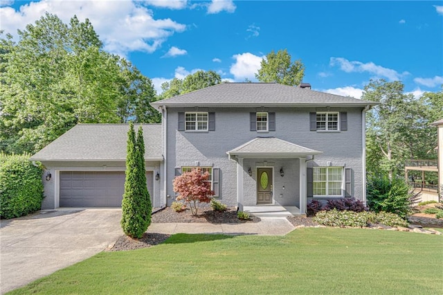 4039 Sargent Cir, Gainesville, GA 30506 - colonial-style house with an attached garage, driveway, a front lawn, and brick siding