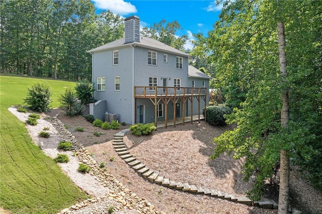 4039 Sargent Cir, Gainesville, GA 30506 - rear view of house with a chimney, a deck, a lawn, and stucco siding