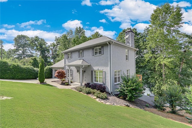 4039 Sargent Cir, Gainesville, GA 30506 - colonial home featuring a chimney, a front yard, a garage, and brick siding
