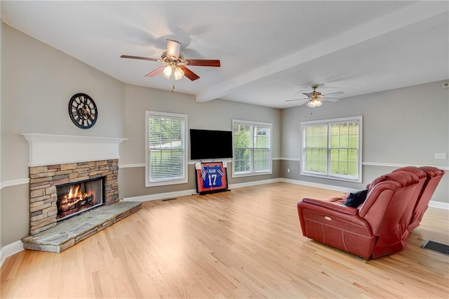 4039 Sargent Cir, Gainesville, GA 30506 - living area with a ceiling fan, a fireplace, wood finished floors, baseboards, and beam ceiling
