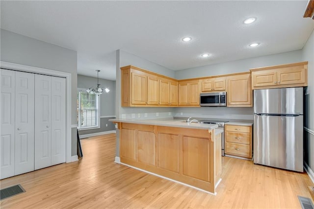 4039 Sargent Cir, Gainesville, GA 30506 - kitchen featuring appliances with stainless steel finishes, light brown cabinets, light countertops, recessed lighting, and a textured ceiling