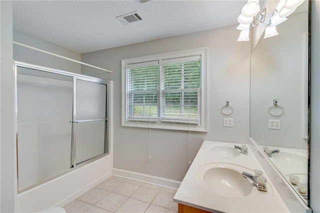 4039 Sargent Cir, Gainesville, GA 30506 - full bathroom featuring double vanity, tile patterned floors, combined bath / shower with glass door, a textured ceiling, and baseboards