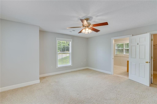 4039 Sargent Cir, Gainesville, GA 30506 - spare room with ceiling fan, light carpet, baseboards, and a textured ceiling