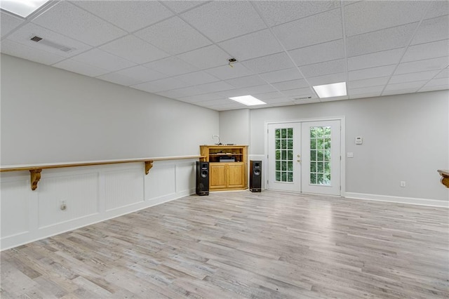 4039 Sargent Cir, Gainesville, GA 30506 - unfurnished living room with light wood-style floors, a drop ceiling, and baseboards