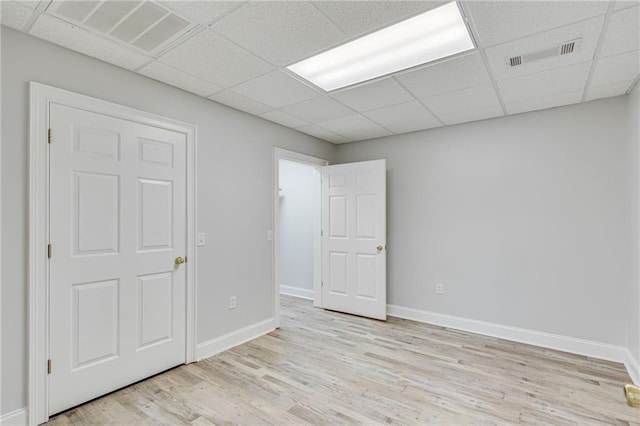 4039 Sargent Cir, Gainesville, GA 30506 - unfurnished bedroom with light wood finished floors, baseboards, and a drop ceiling