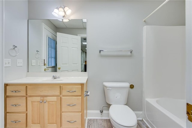 4039 Sargent Cir, Gainesville, GA 30506 - full bathroom featuring toilet, vanity, wood finished floors, shower / tub combination, and baseboards