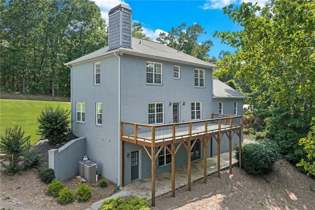 4039 Sargent Cir, Gainesville, GA 30506 - rear view of house with a wooden deck, a chimney, a shingled roof, and central AC unit