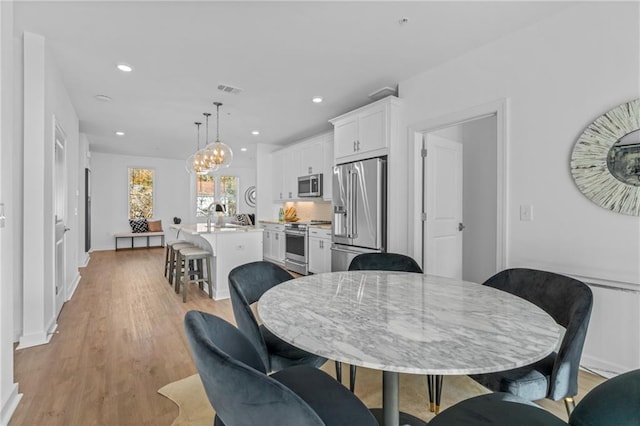 388 Pratt Dr Unit 2113, Atlanta, GA 30315 - dining room featuring a chandelier, recessed lighting, and light wood-style floors