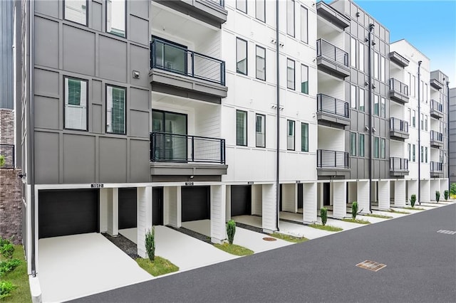 388 Pratt Dr Unit 2113, Atlanta, GA 30315 - view of apartment building / complex featuring a garage and driveway