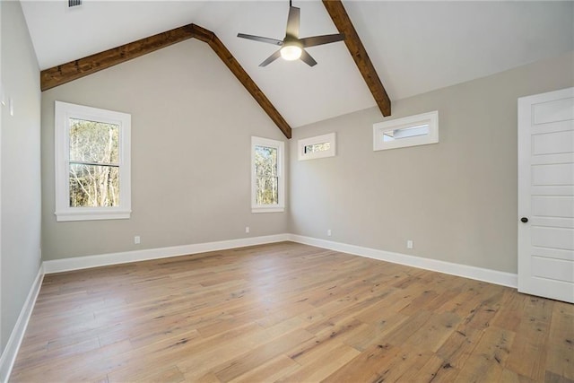 spare room featuring ceiling fan, light wood-style flooring, and baseboards