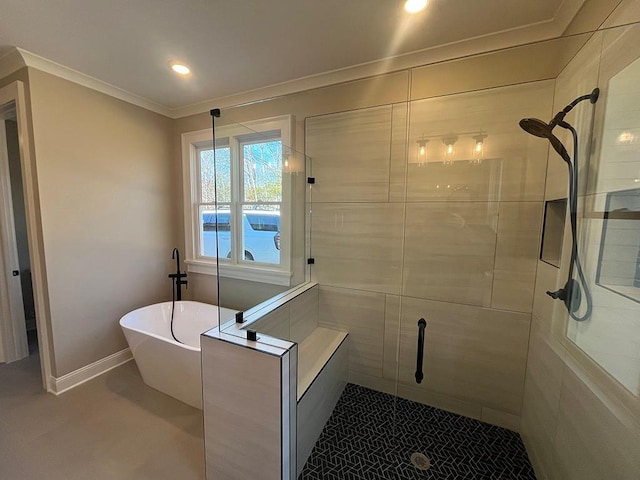 full bathroom featuring a stall shower, a freestanding tub, crown molding, recessed lighting, and baseboards