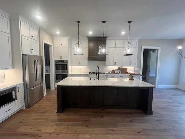 kitchen featuring appliances with stainless steel finishes, decorative backsplash, recessed lighting, and white cabinets