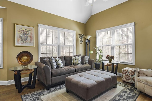 living room with hardwood / wood-style floors, ceiling fan, and lofted ceiling