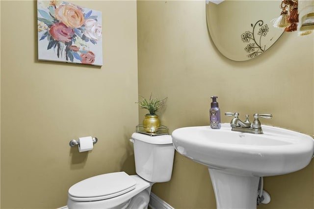 bathroom with sink and toilet