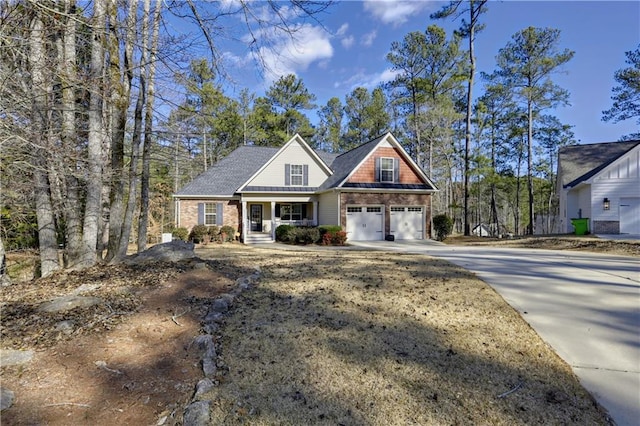 view of front of house with a porch and a garage