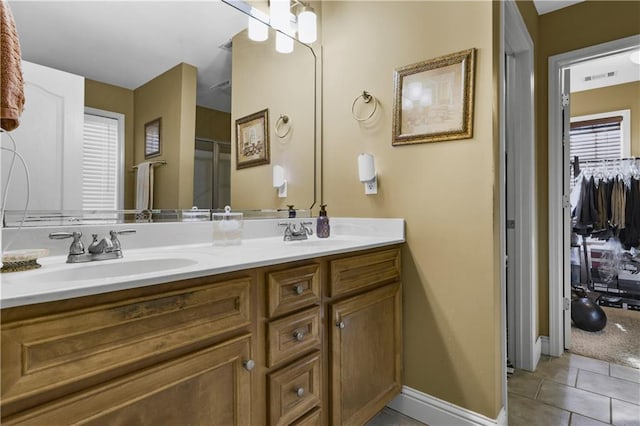 bathroom featuring tile patterned flooring and vanity