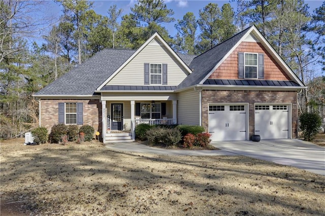 craftsman house with a porch and a garage