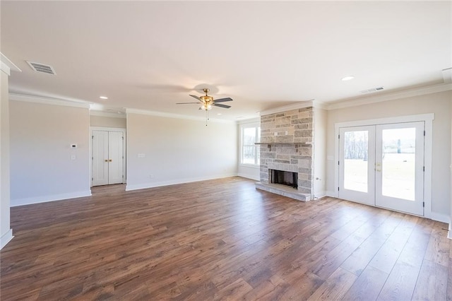 unfurnished living room featuring ornamental molding, visible vents, and dark wood finished floors