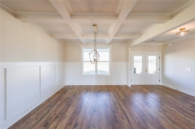 entrance foyer with coffered ceiling, dark wood-type flooring, beam ceiling, and a wainscoted wall