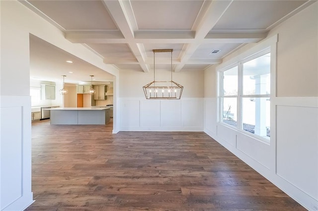 interior space featuring visible vents, dark wood-style flooring, coffered ceiling, and beam ceiling