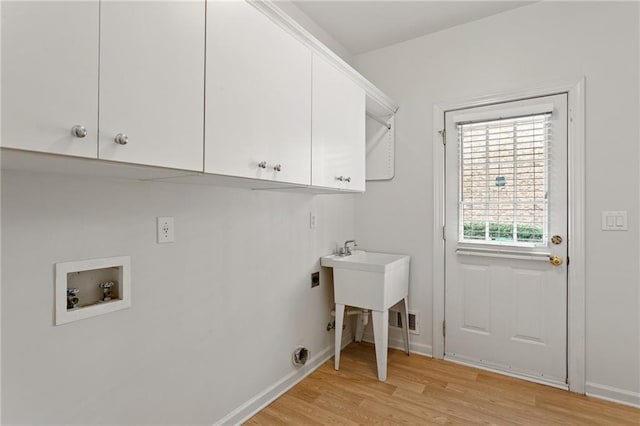 laundry area with baseboards, washer hookup, light wood-style floors, cabinet space, and hookup for an electric dryer