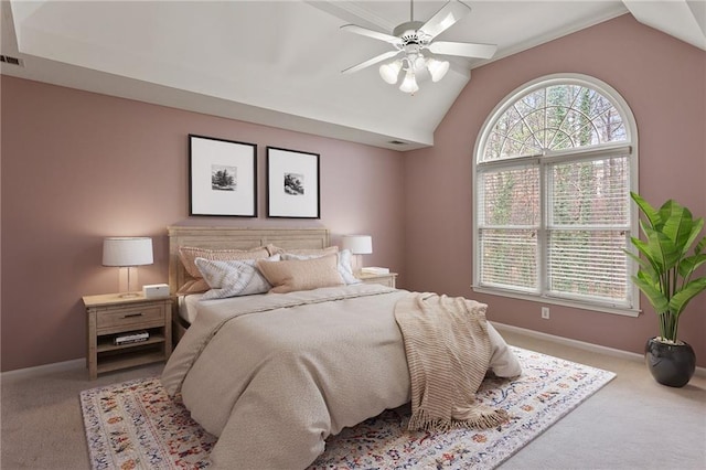 bedroom featuring lofted ceiling, multiple windows, and baseboards