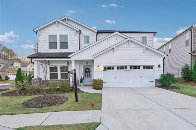 view of front of home with a front yard and a garage