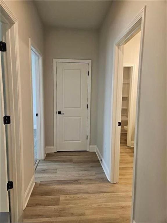 1695 Crumbley Rd, Mcdonough, GA 30252 - hall featuring light wood-style flooring and baseboards