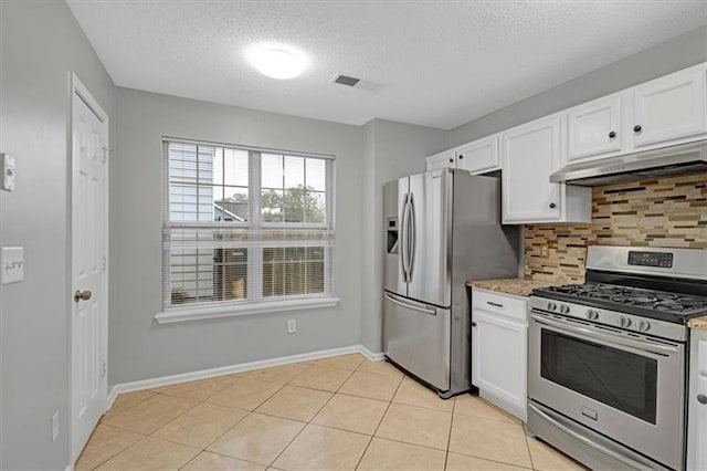 kitchen featuring white cabinetry, under cabinet range hood, and appliances with stainless steel finishes