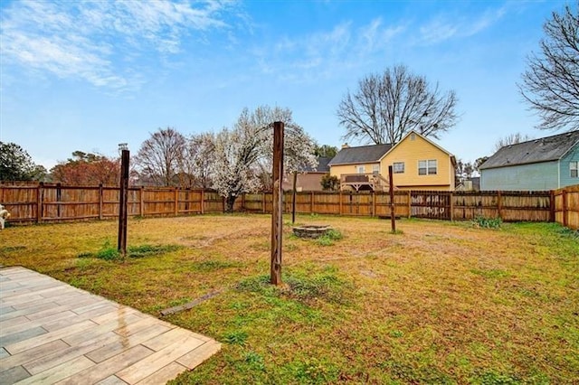 view of yard featuring a patio area and a fenced backyard