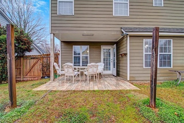 back of house with a patio, a yard, and fence