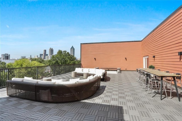 view of patio / terrace featuring outdoor lounge area and a bar