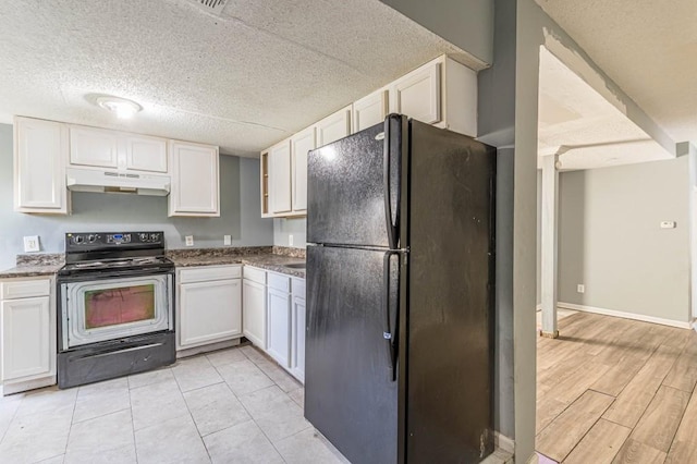 kitchen with black appliances, white cabinetry, and a textured ceiling