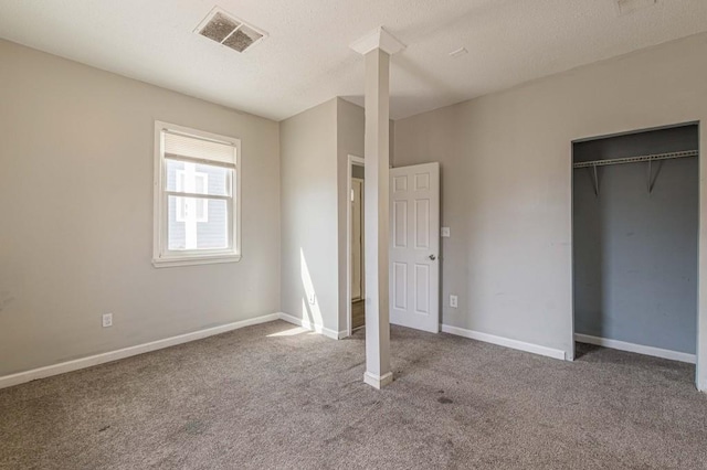 unfurnished bedroom featuring a closet and carpet floors