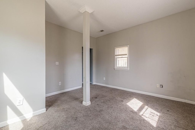 unfurnished room featuring carpet