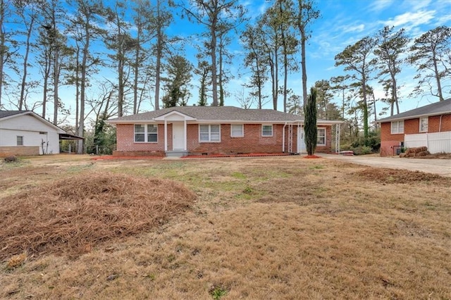 ranch-style house with a front lawn