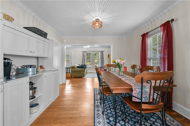 511 Robinson Ave SE, Atlanta, GA 30315 - dining area featuring light wood-style flooring, ornamental molding, and french doors