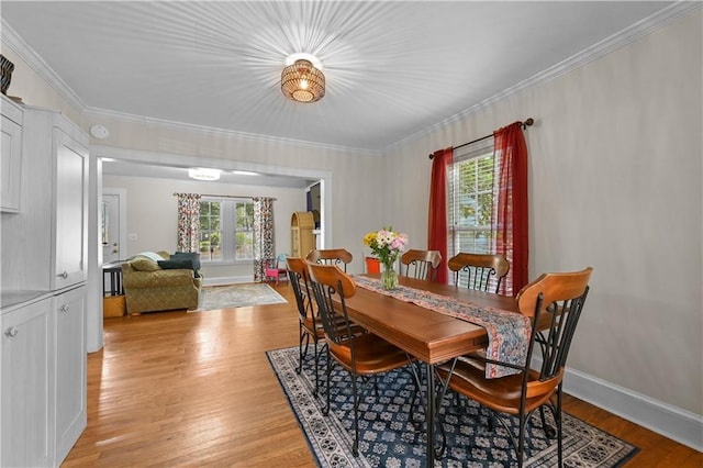 511 Robinson Ave SE, Atlanta, GA 30315 - dining space featuring ornamental molding and light wood-style floors