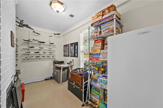 511 Robinson Ave SE, Atlanta, GA 30315 - rec room featuring light tile patterned flooring, ornamental molding, a desk, and a fireplace