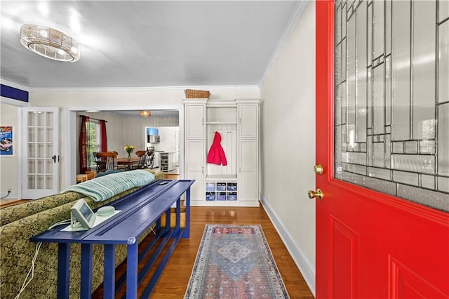511 Robinson Ave SE, Atlanta, GA 30315 - entrance foyer featuring crown molding, wood finished floors, and baseboards