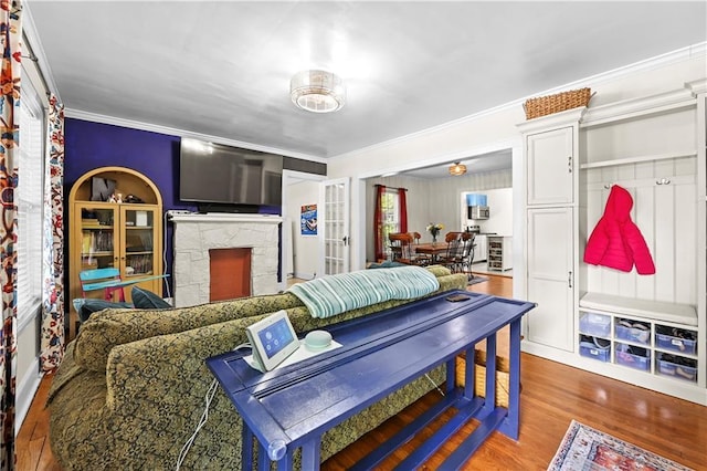511 Robinson Ave SE, Atlanta, GA 30315 - living room featuring ornamental molding, wood finished floors, and a fireplace