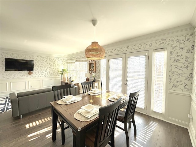 dining space with french doors, dark hardwood / wood-style flooring, and ornamental molding