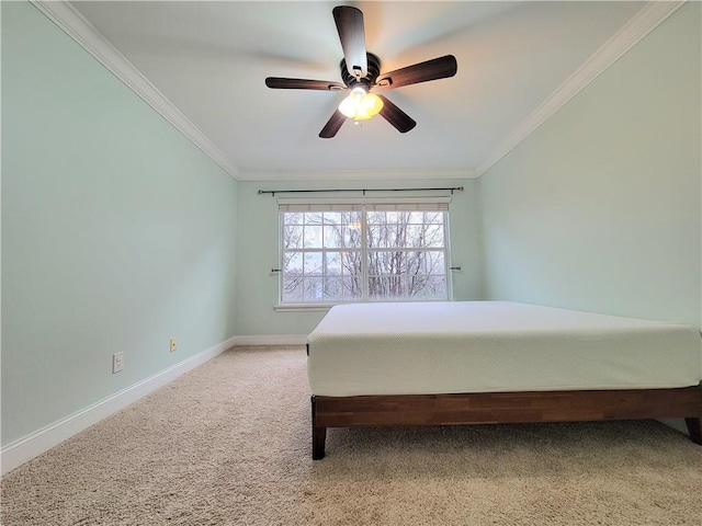 carpeted bedroom with ceiling fan and crown molding