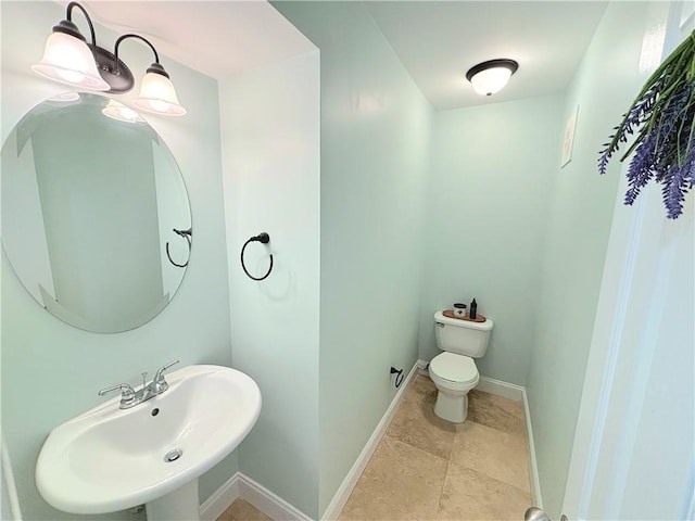 bathroom featuring sink and toilet